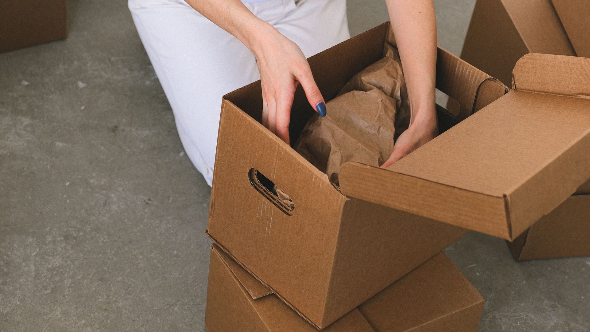 Packing a family member’s belongings into moving boxes